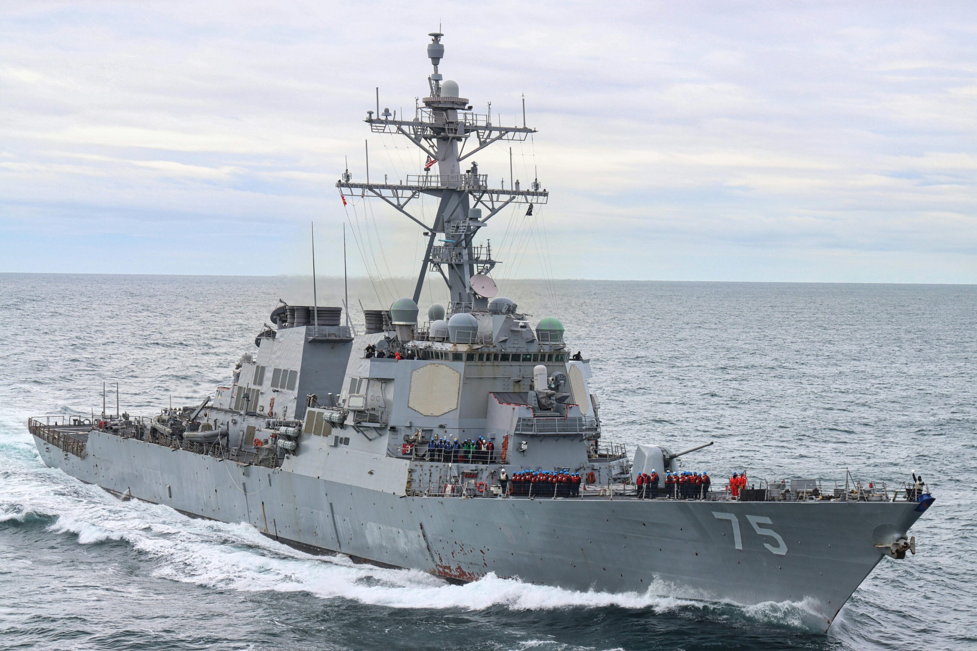 A large military ship sailing in the ocean.